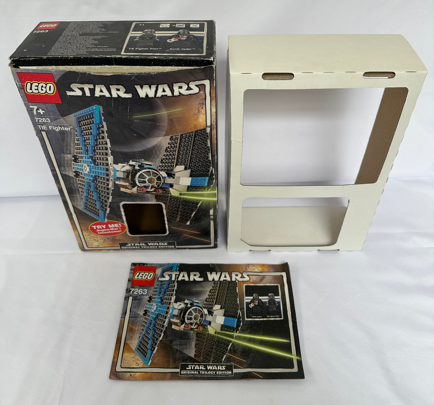 LEGO Star Wars packaging with a display stand on a white background