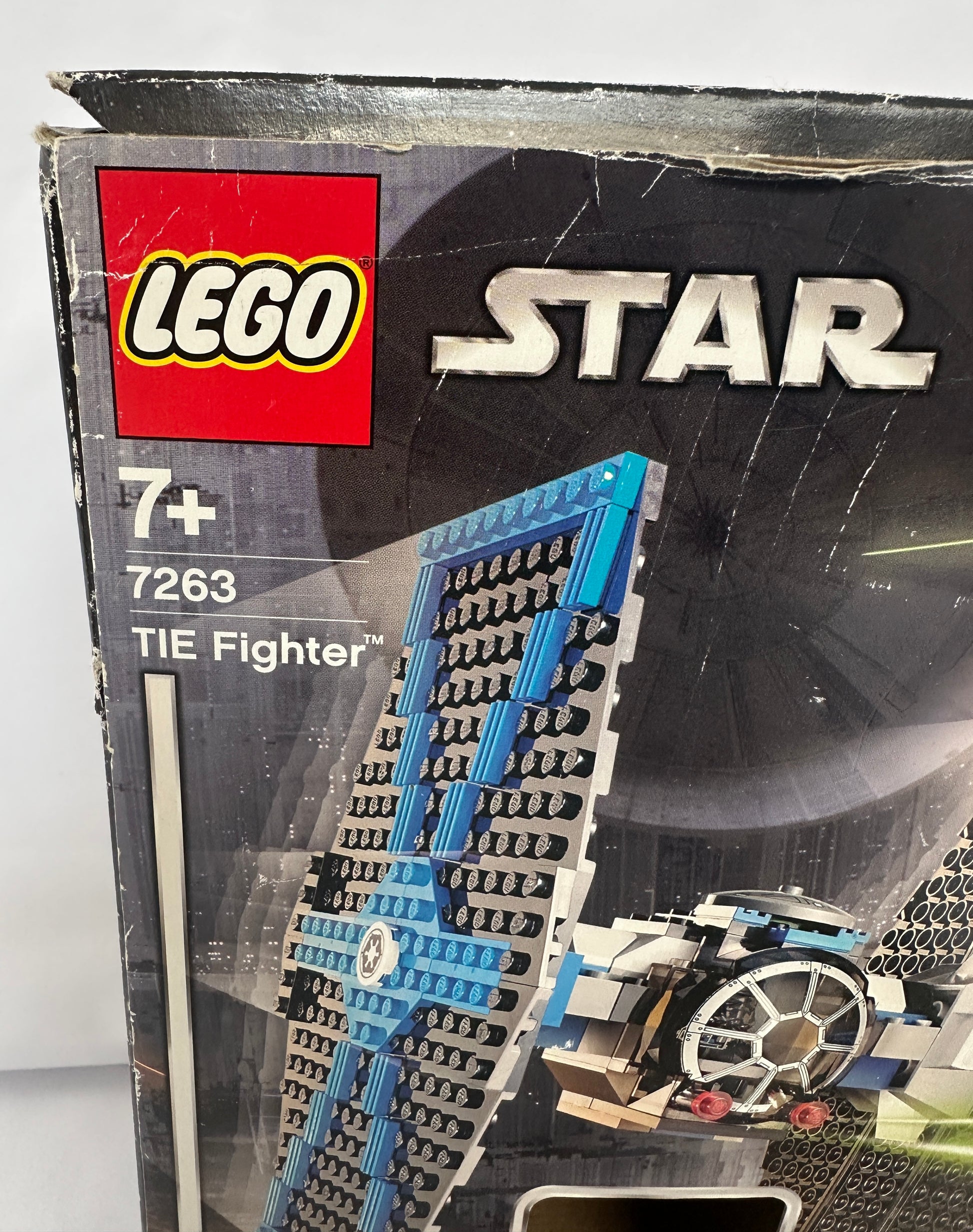 LEGO Star Wars TIE Fighter set packaging with branding and product details.