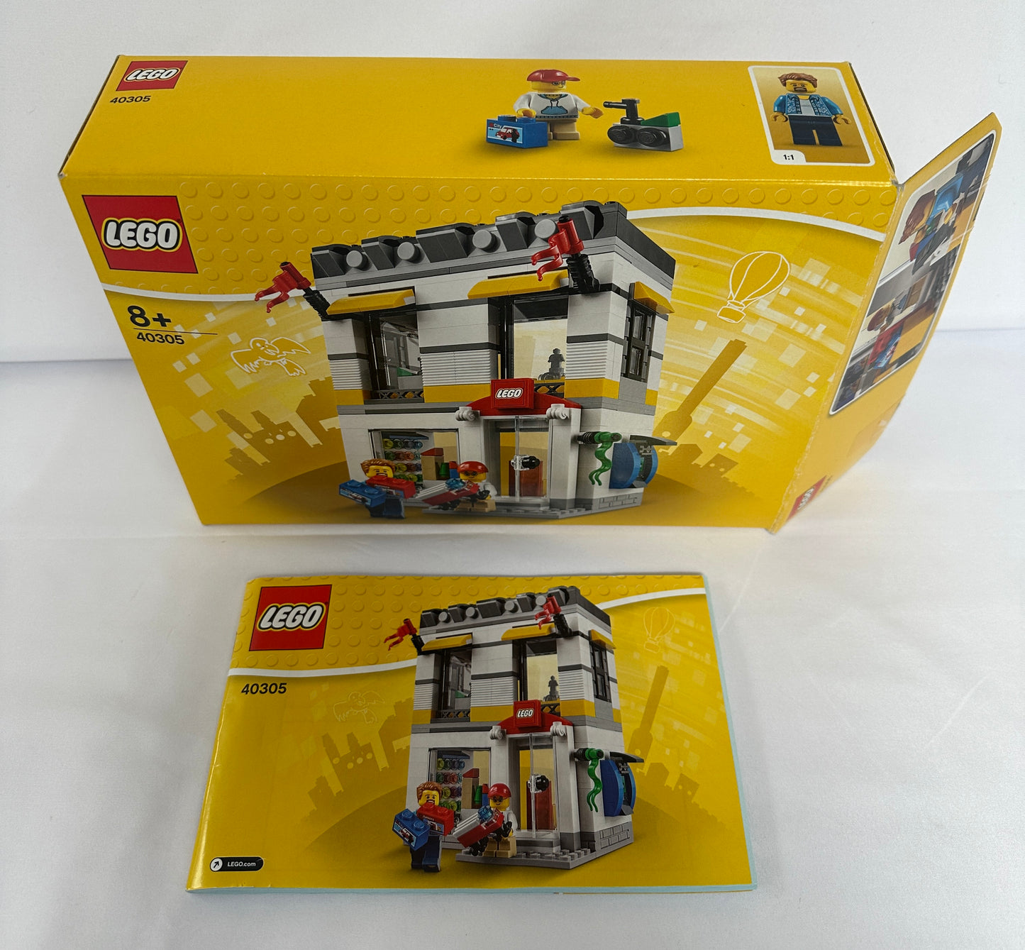 LEGO set packaging with yellow box and model on a white background