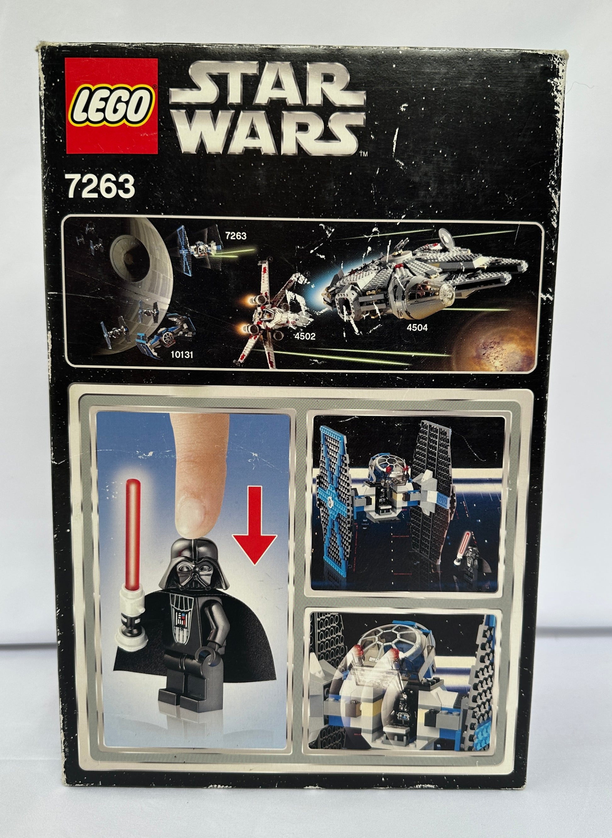 Lego Star Wars set packaging with Darth Vader figure and space ship models.