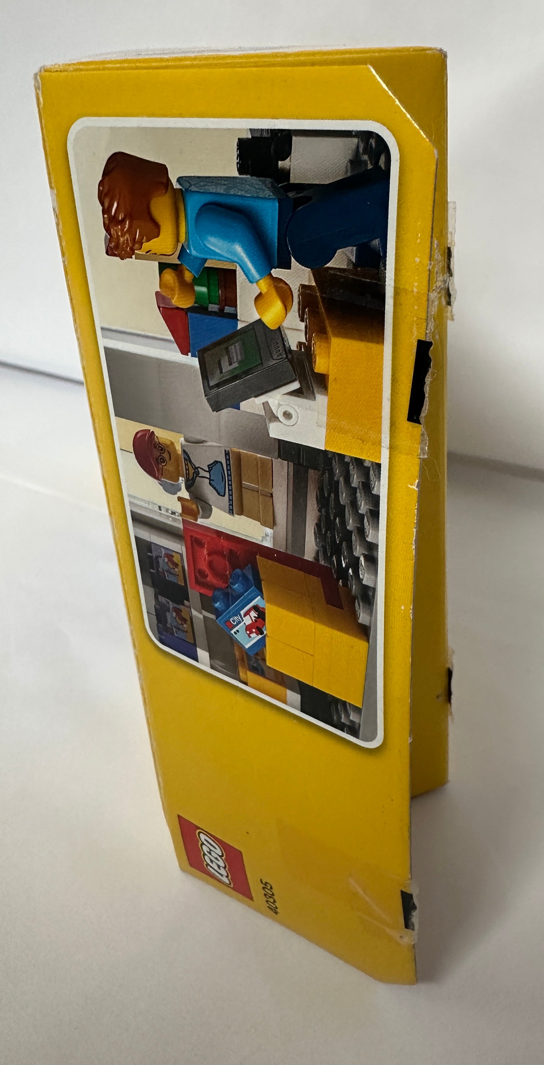 Toy figure in a yellow box with a white background