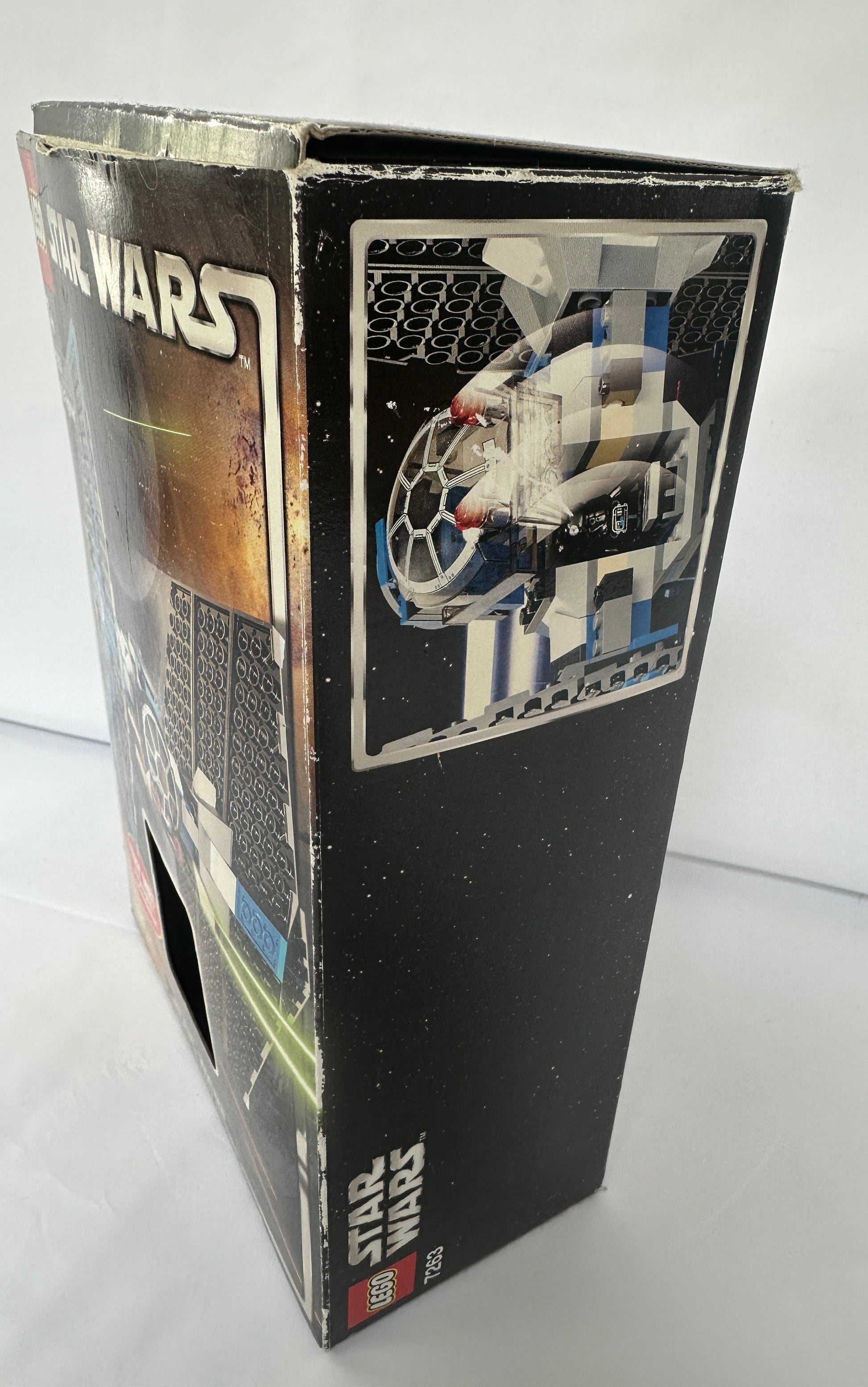 Star Wars toy packaging with a spaceship illustration on a white background