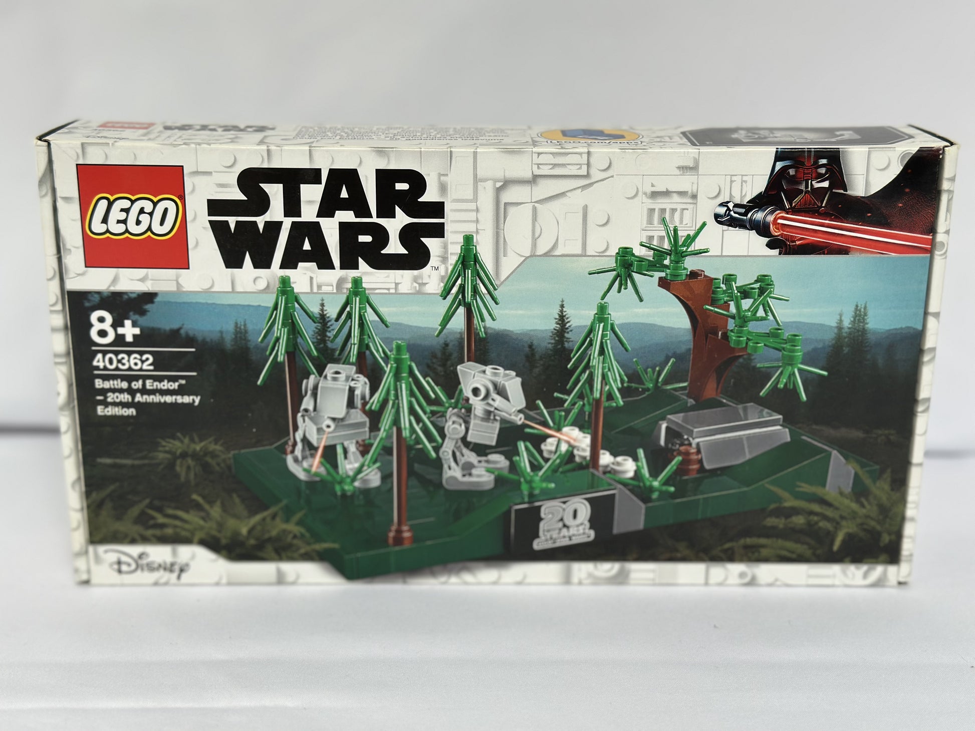 LEGO Star Wars set packaging with trees and robots on a gray background