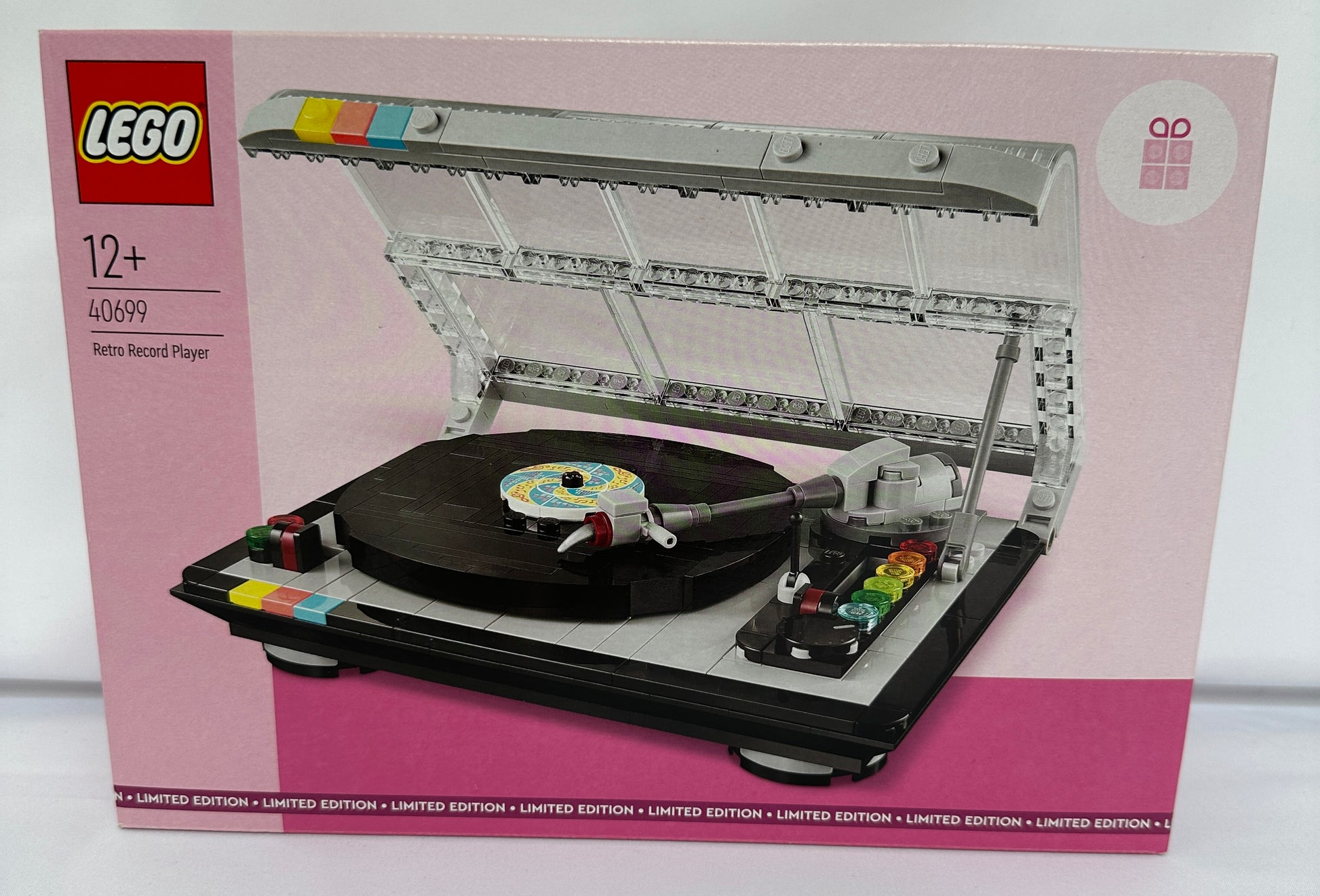 LEGO record player set packaging on a pink background