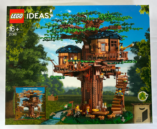 LEGO Ideas treehouse set packaging with detailed treehouse model on a scenic background
