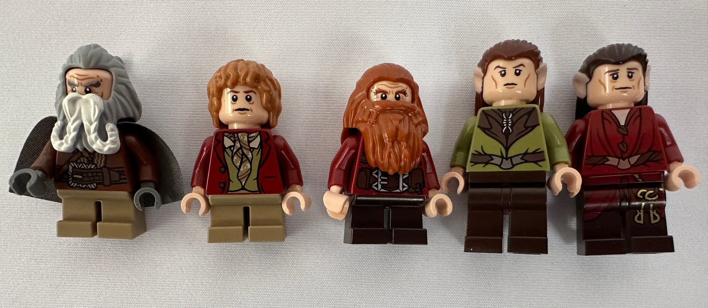 Five LEGO minifigures resembling characters from a fantasy series on a white background