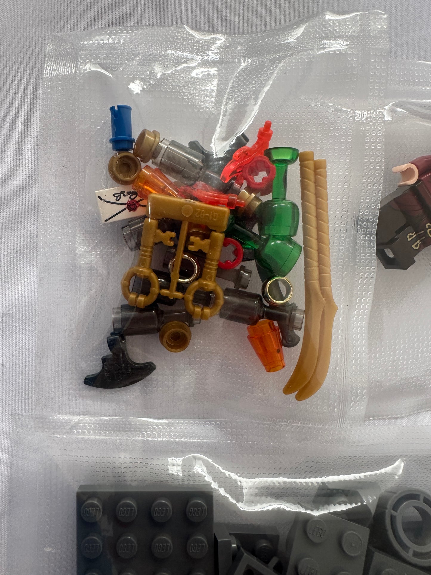 Assorted small plastic pieces on a clear background
