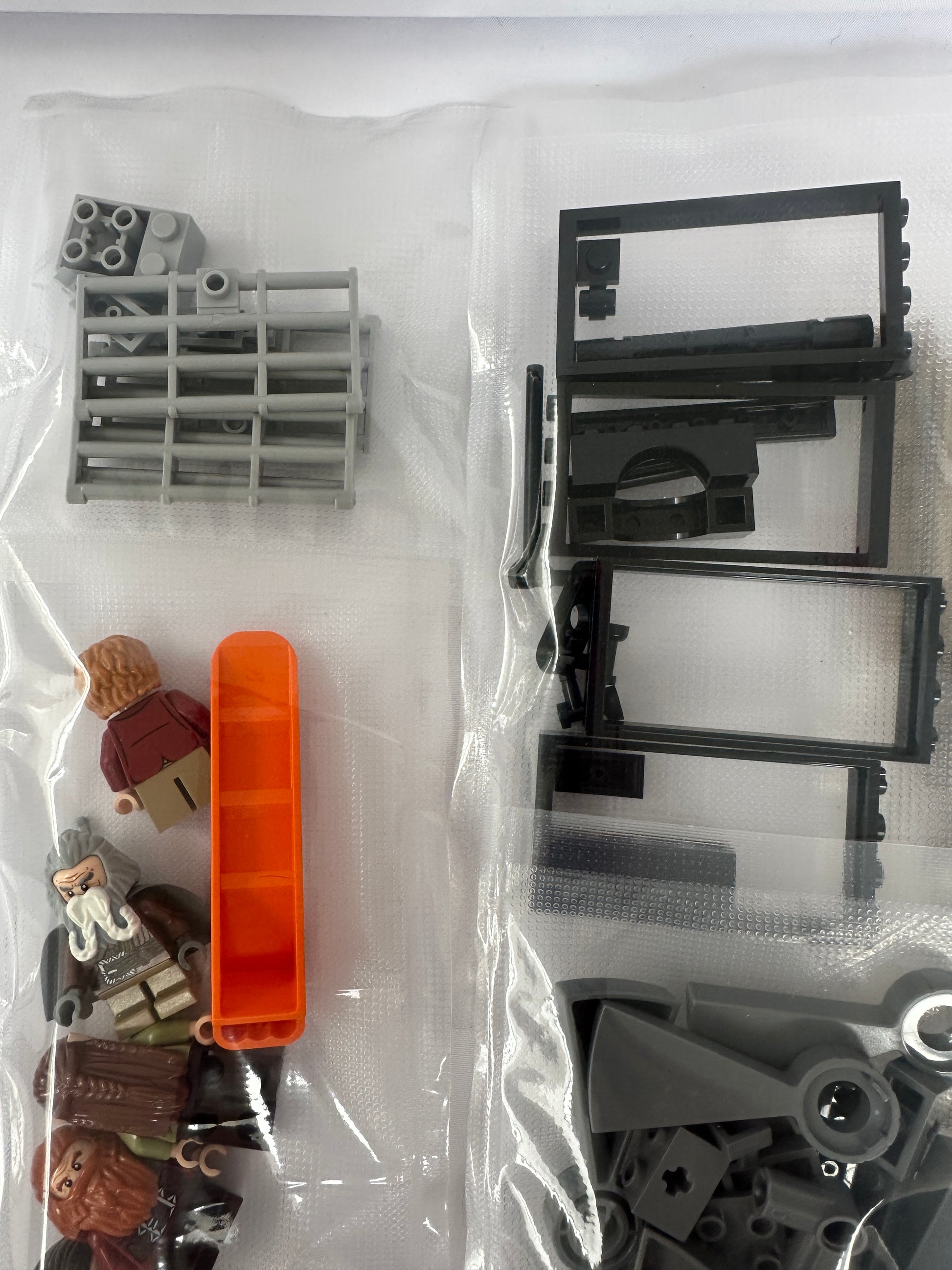 Assorted building blocks and parts on a white background