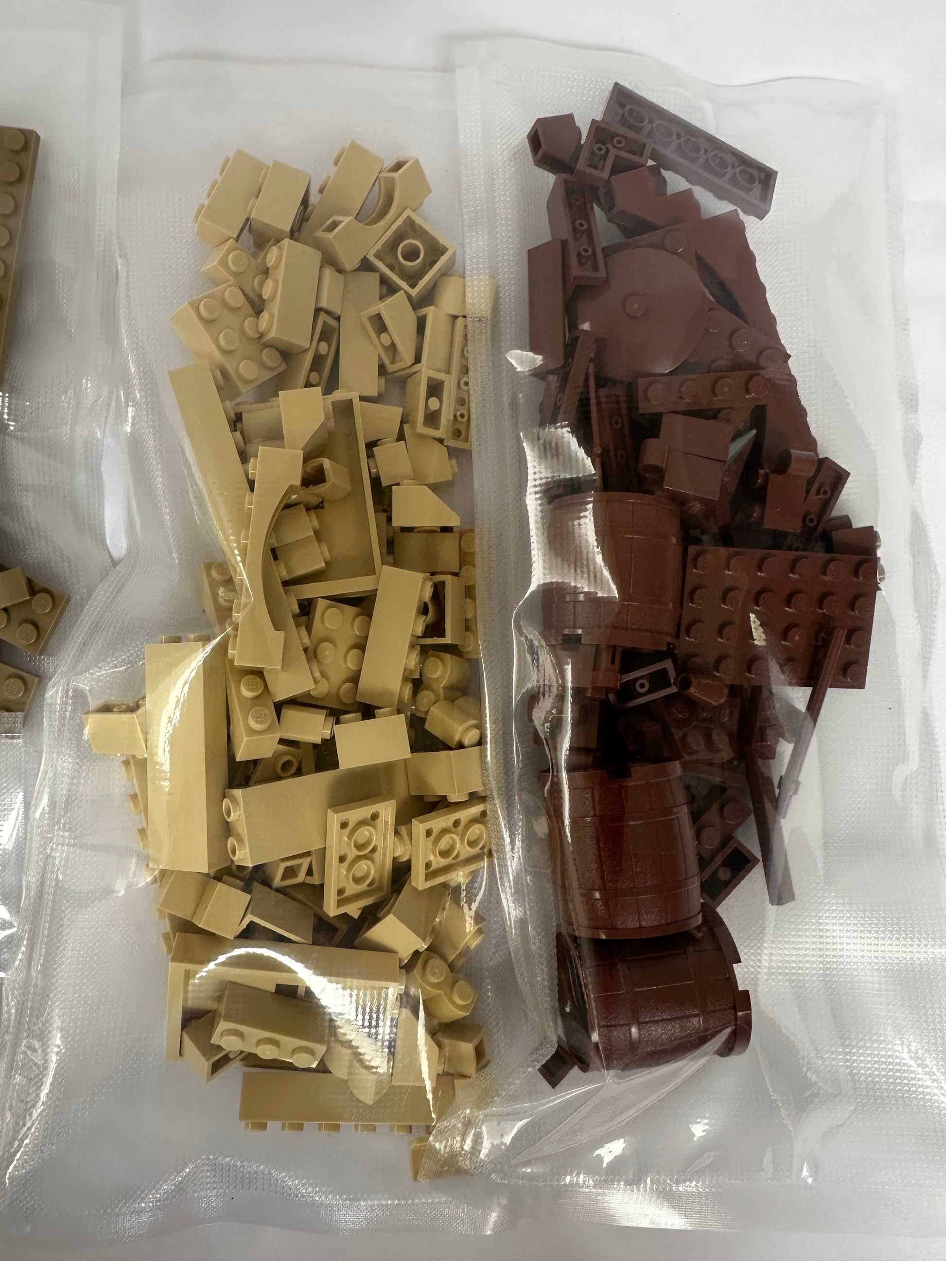 Assorted brown and beige building blocks in a clear plastic bag.