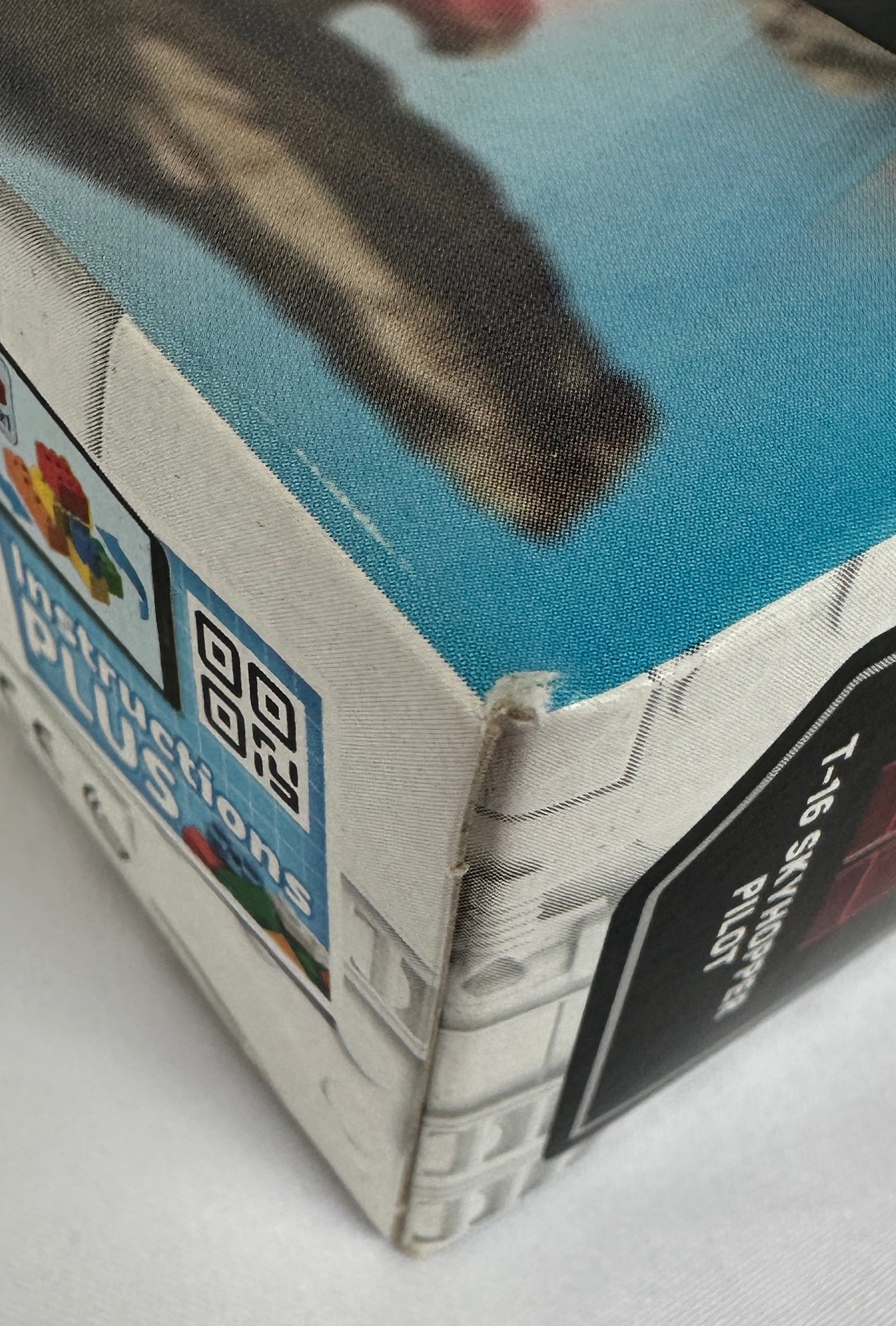 Corner of a Lego box showing slight surface wear