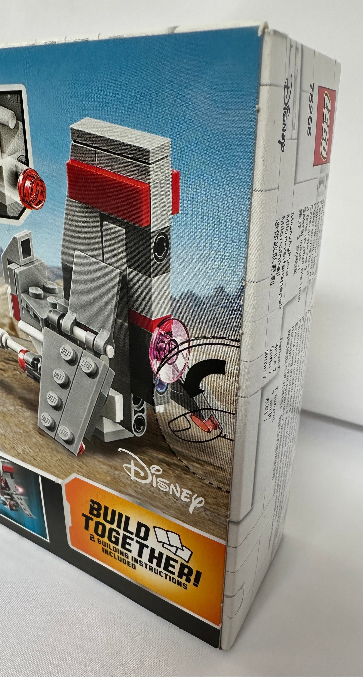 Toy figure on a Disney Build Together packaging with a white background