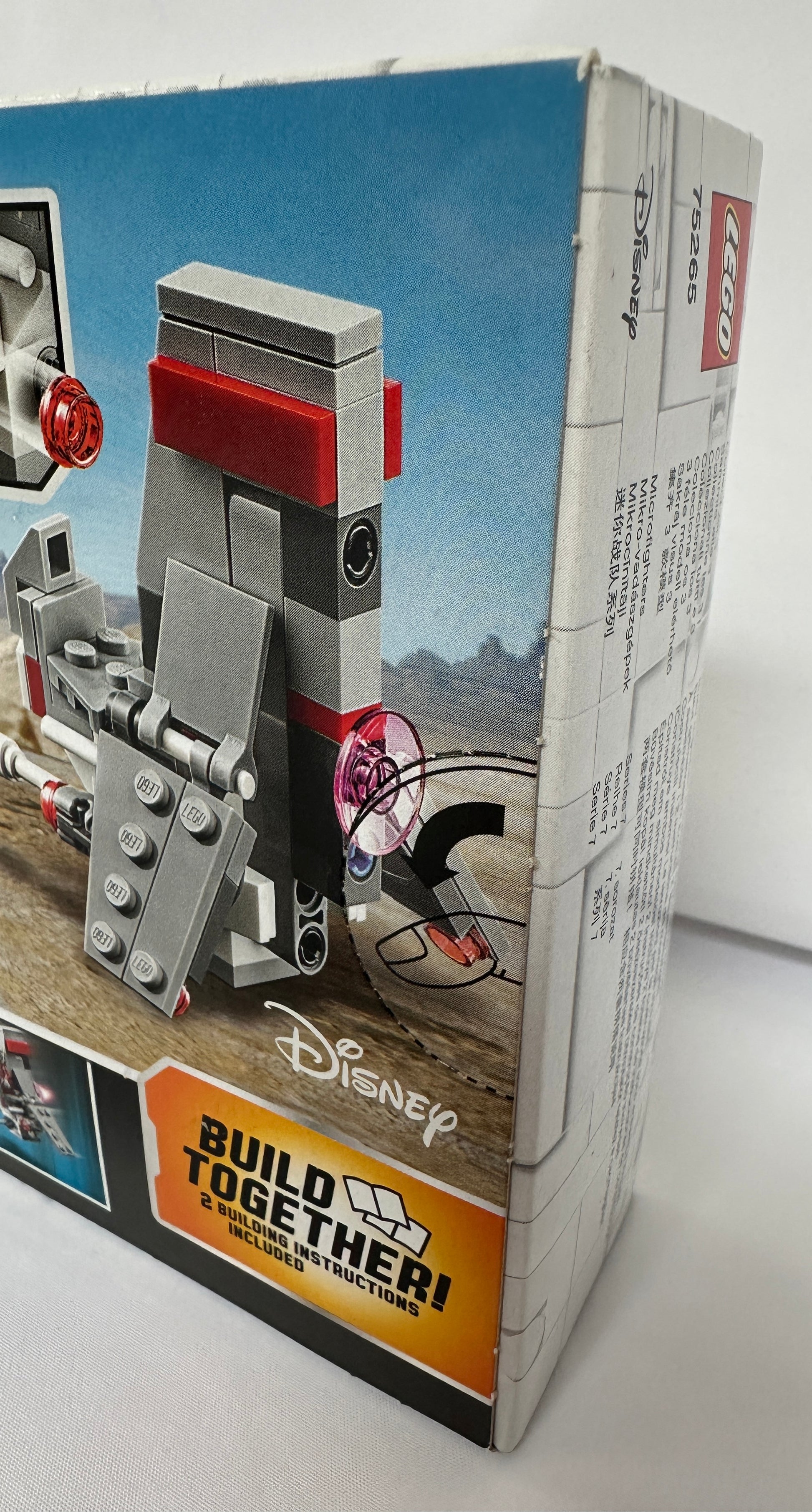 Toy figure on a Disney Build Together packaging with a white background