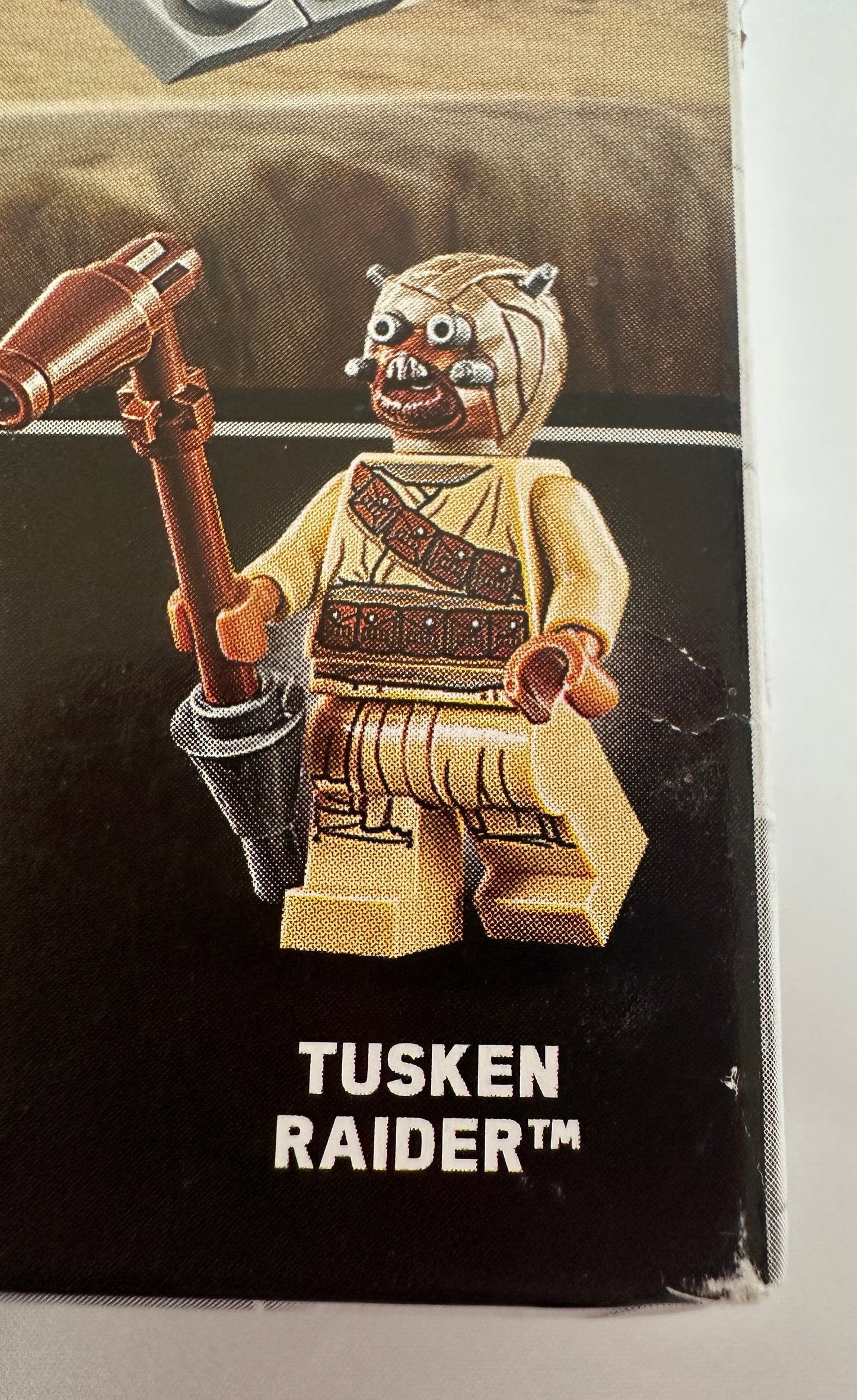 Tusken Raider figure packaging with character and text on a black background