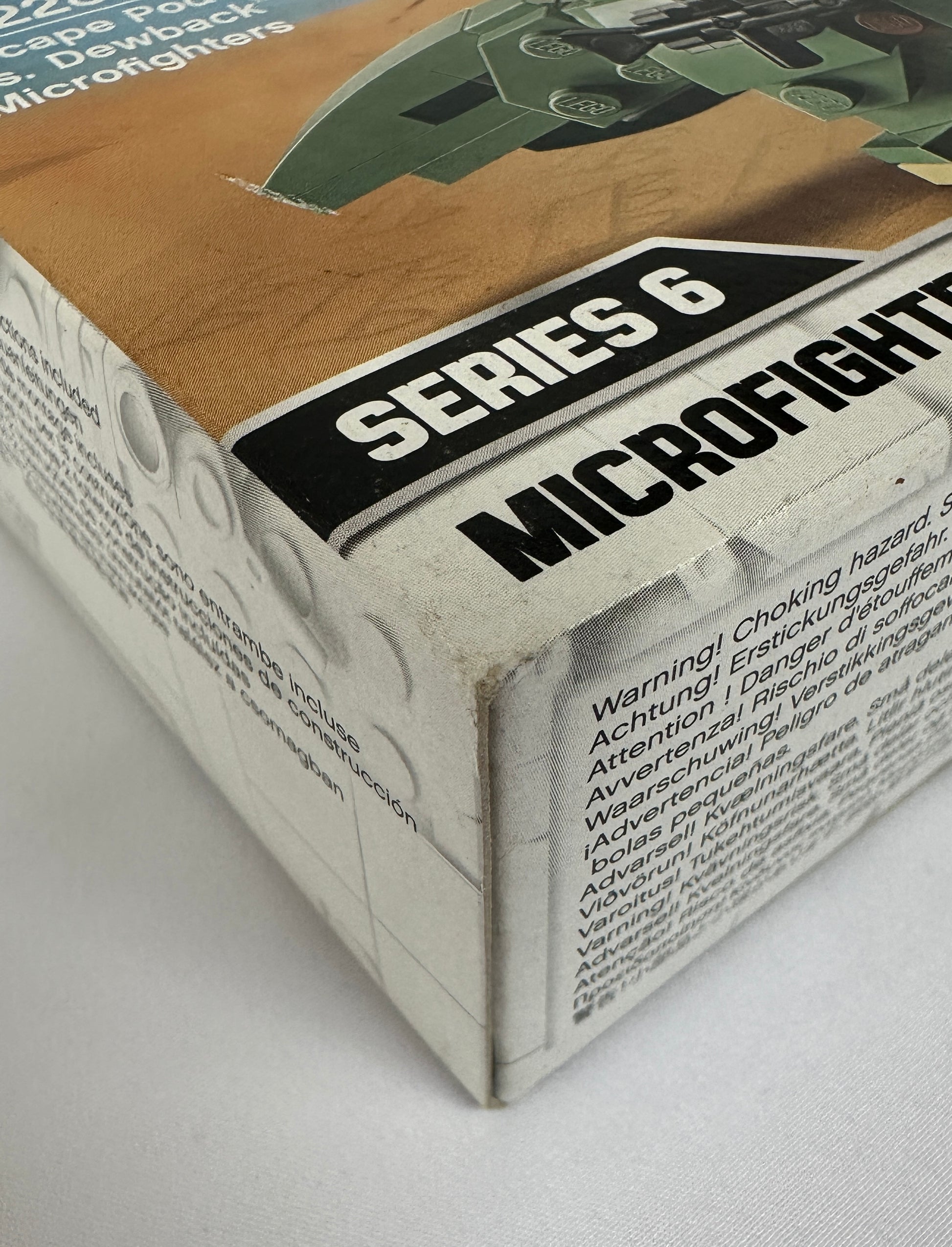 Box of Series 6 Microfighters toy set with warning label on a white background