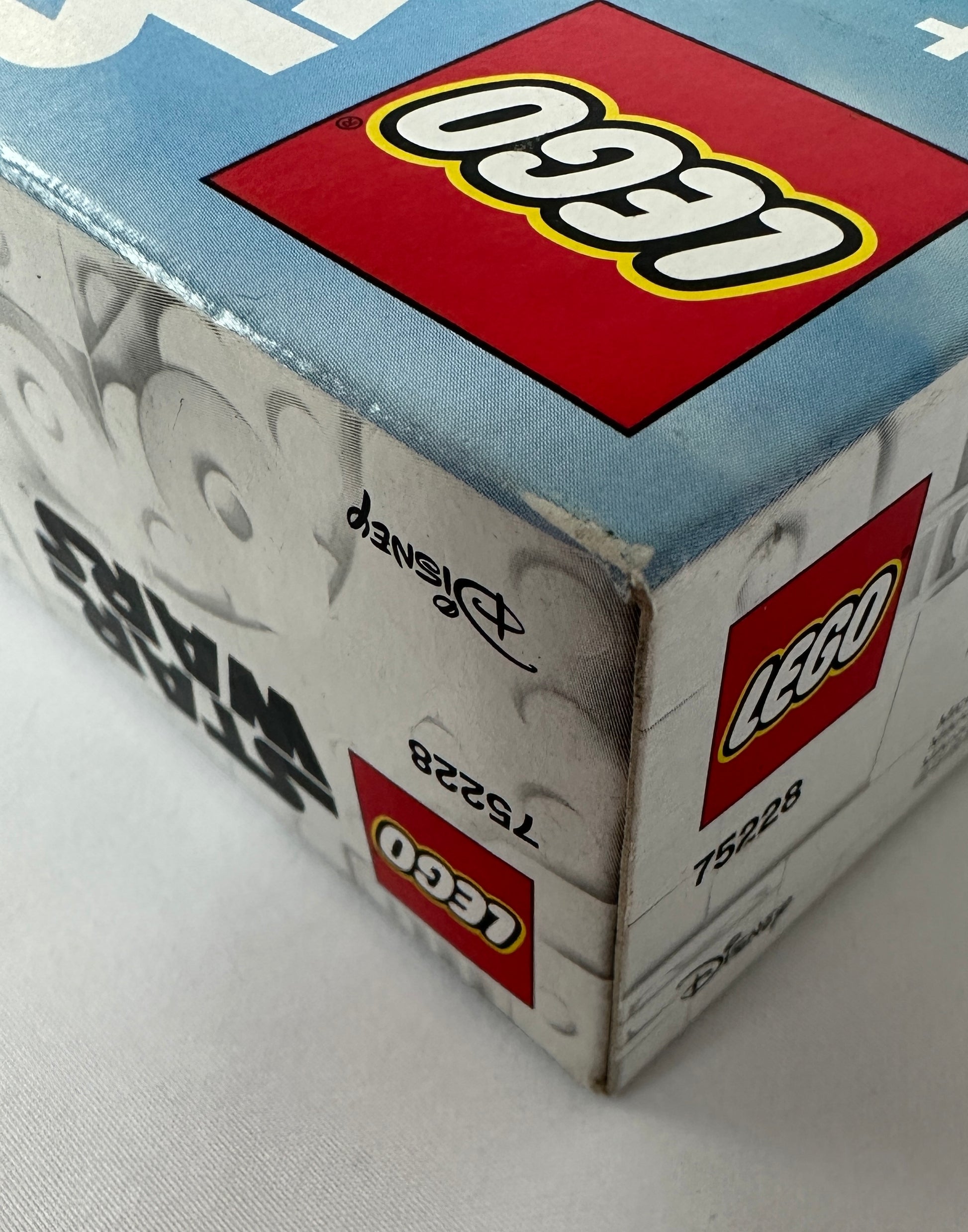 Close-up of a LEGO box with branding and product details.