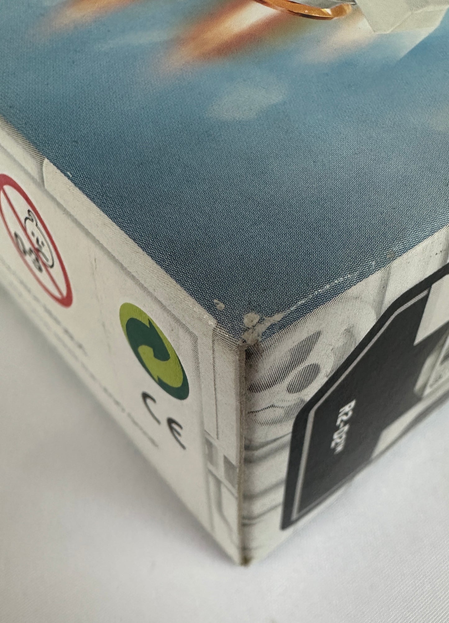 Product packaging with CE mark and other symbols on a white background