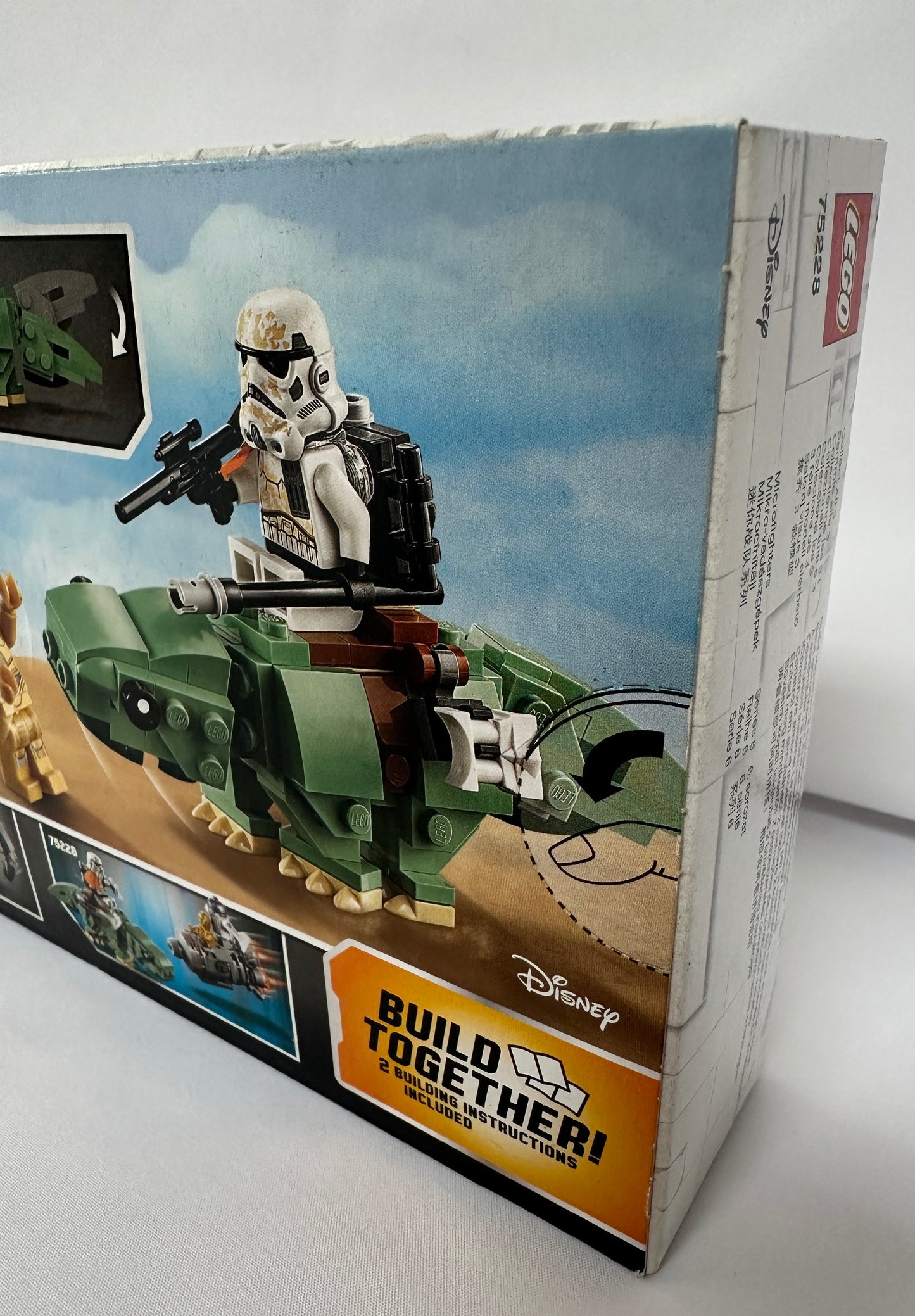 Toy figure on a toy vehicle with 'Build Together' branding on packaging