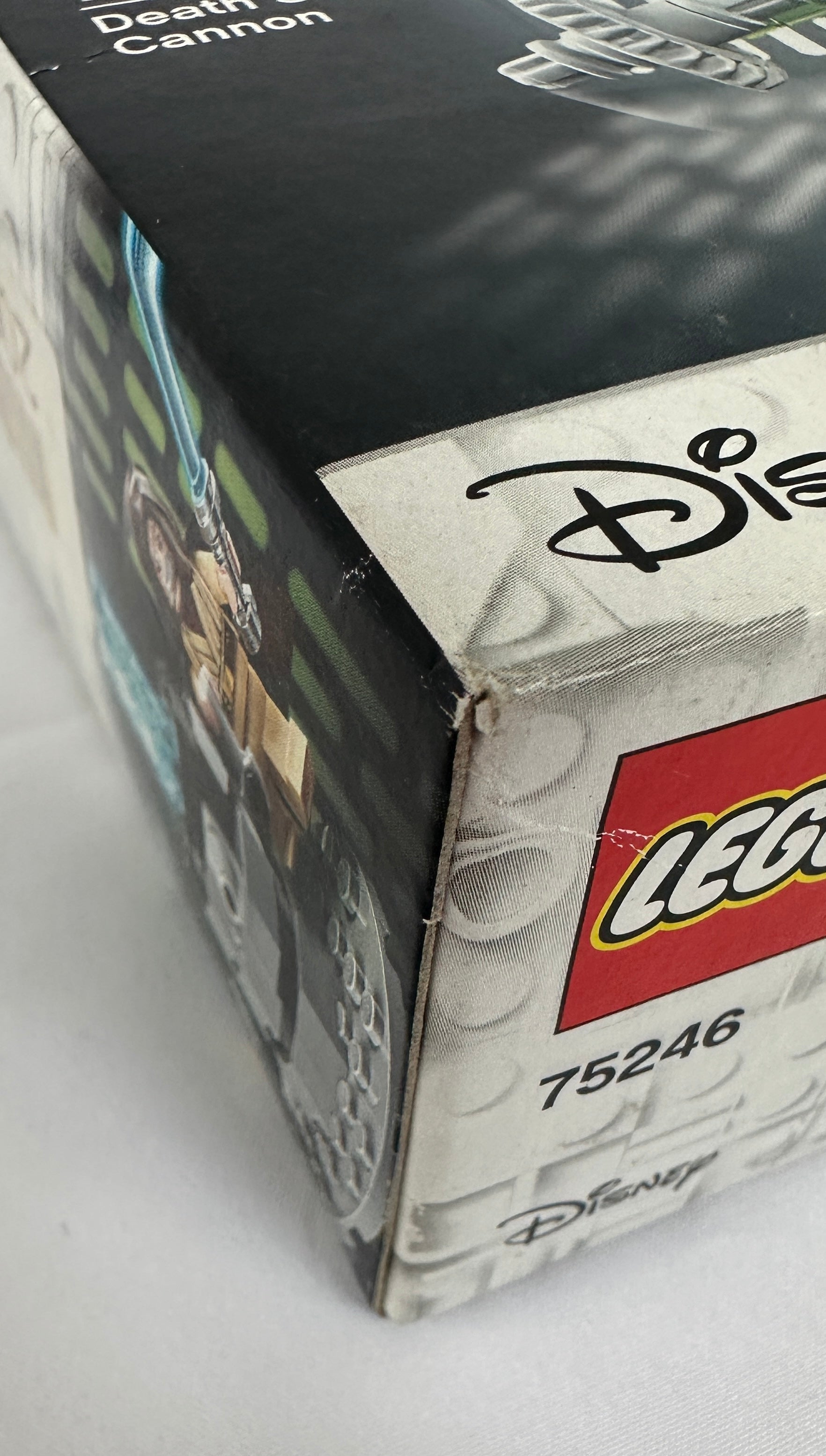 Close-up of a LEGO Disney box with 'Death Cannon' text and LEGO logo.