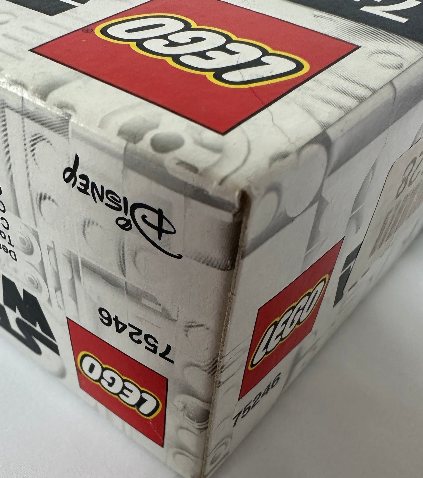 Close-up of a LEGO box with branding and product details.