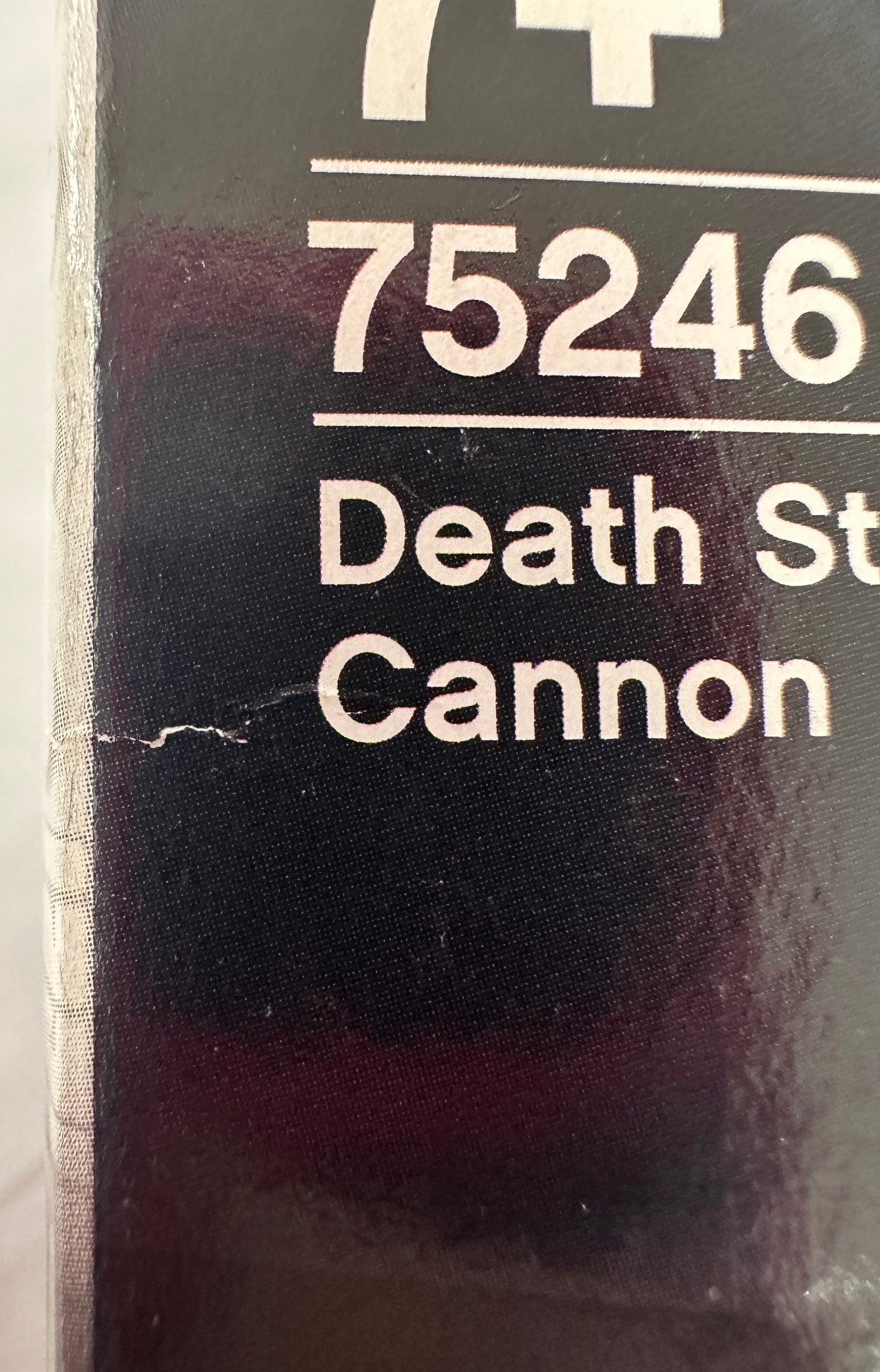 Label with text '75246 Death St Cannon' on a dark background