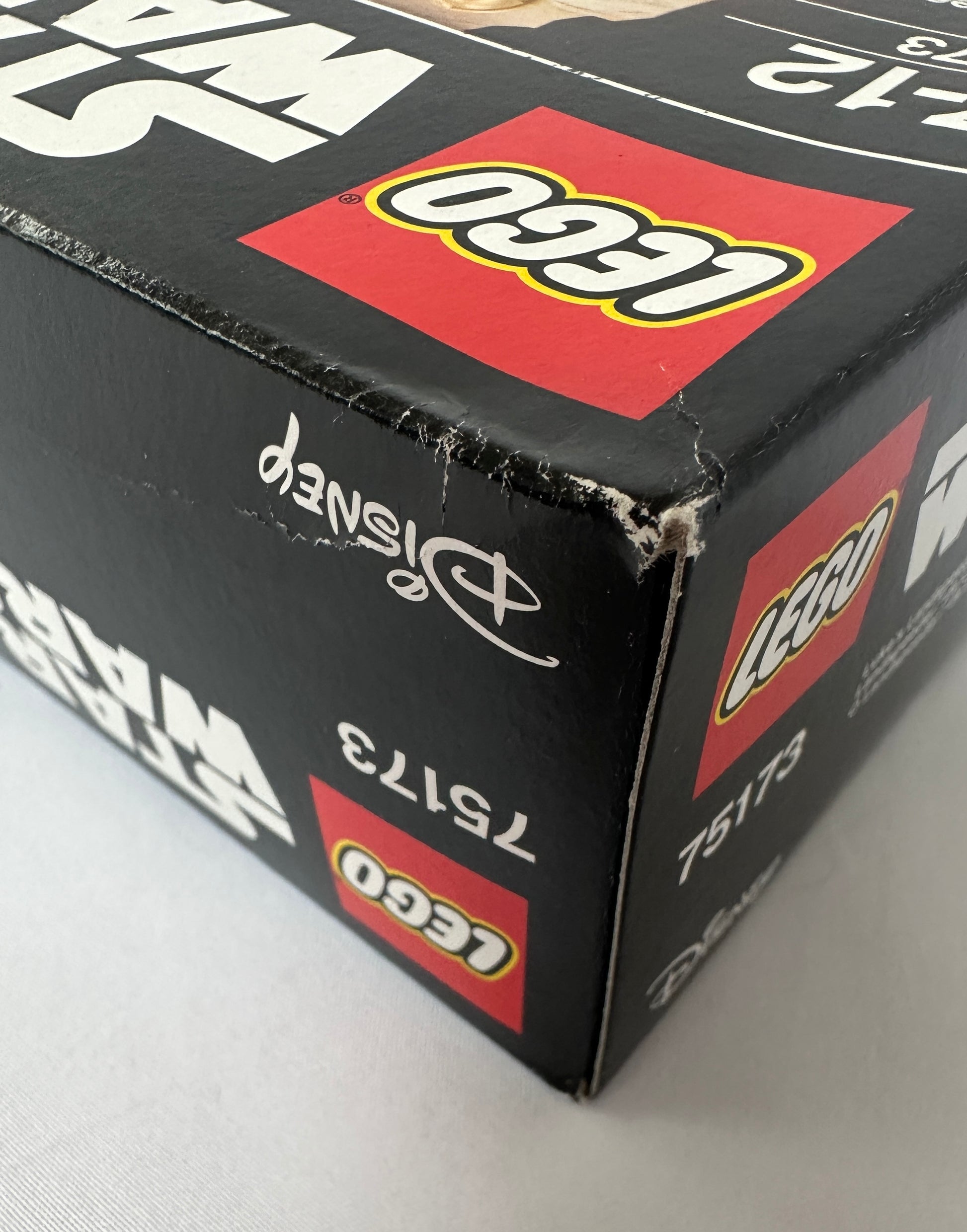 Close-up of a LEGO box with branding and product numbers.