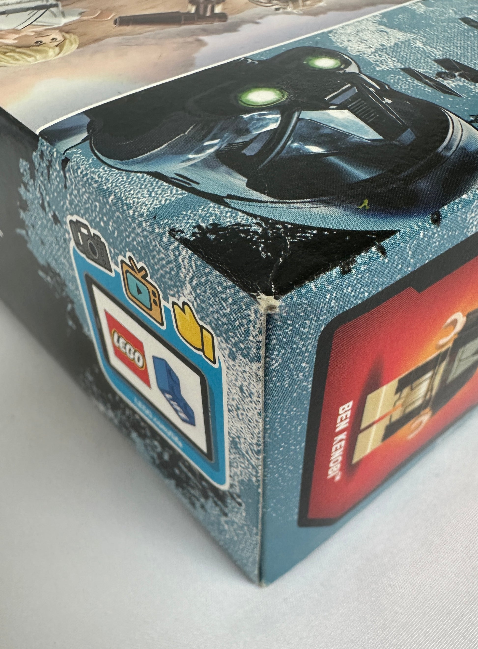 Close-up of a LEGO product packaging with a toy figure on a white surface