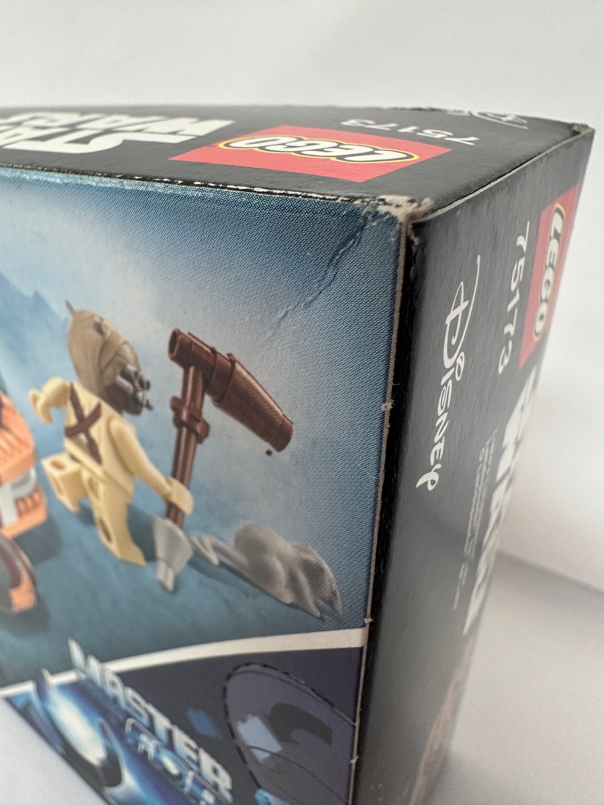 Close-up of a LEGO Disney box with toy illustrations on a white background