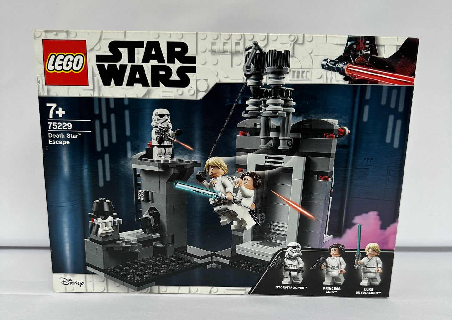 LEGO Star Wars packaging with characters and structures on a gray background