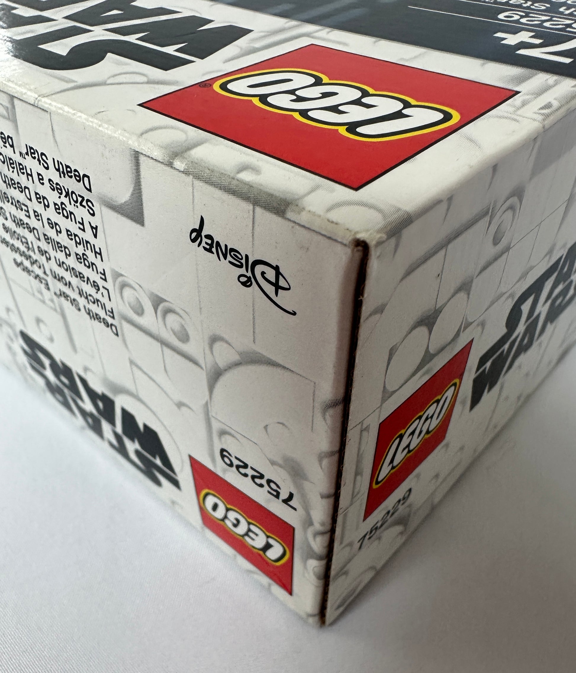 Close-up of a LEGO box with branding and product details.
