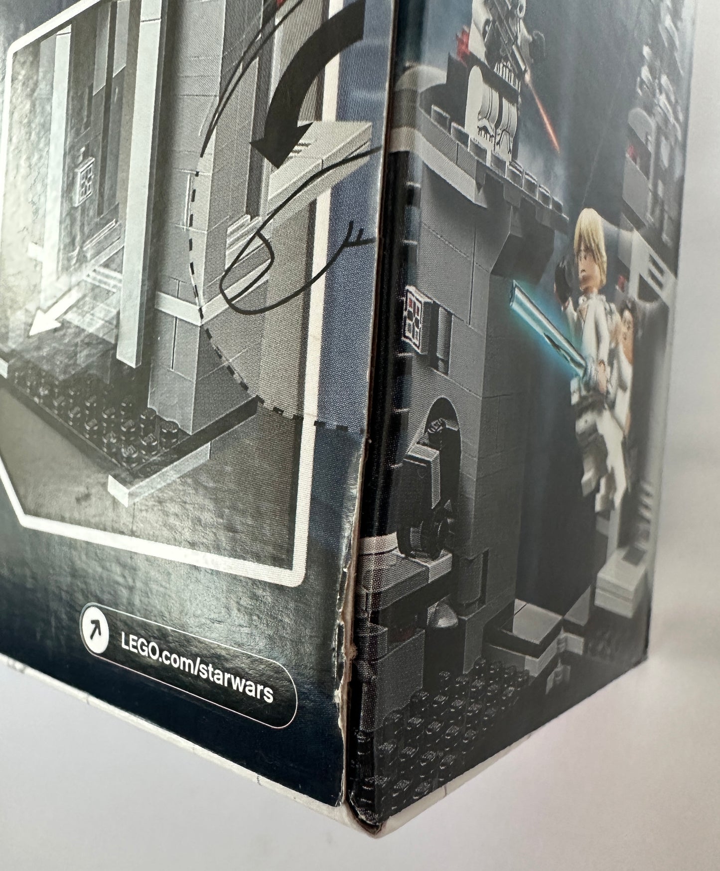 Close-up of a LEGO Star Wars packaging with a model and branding.