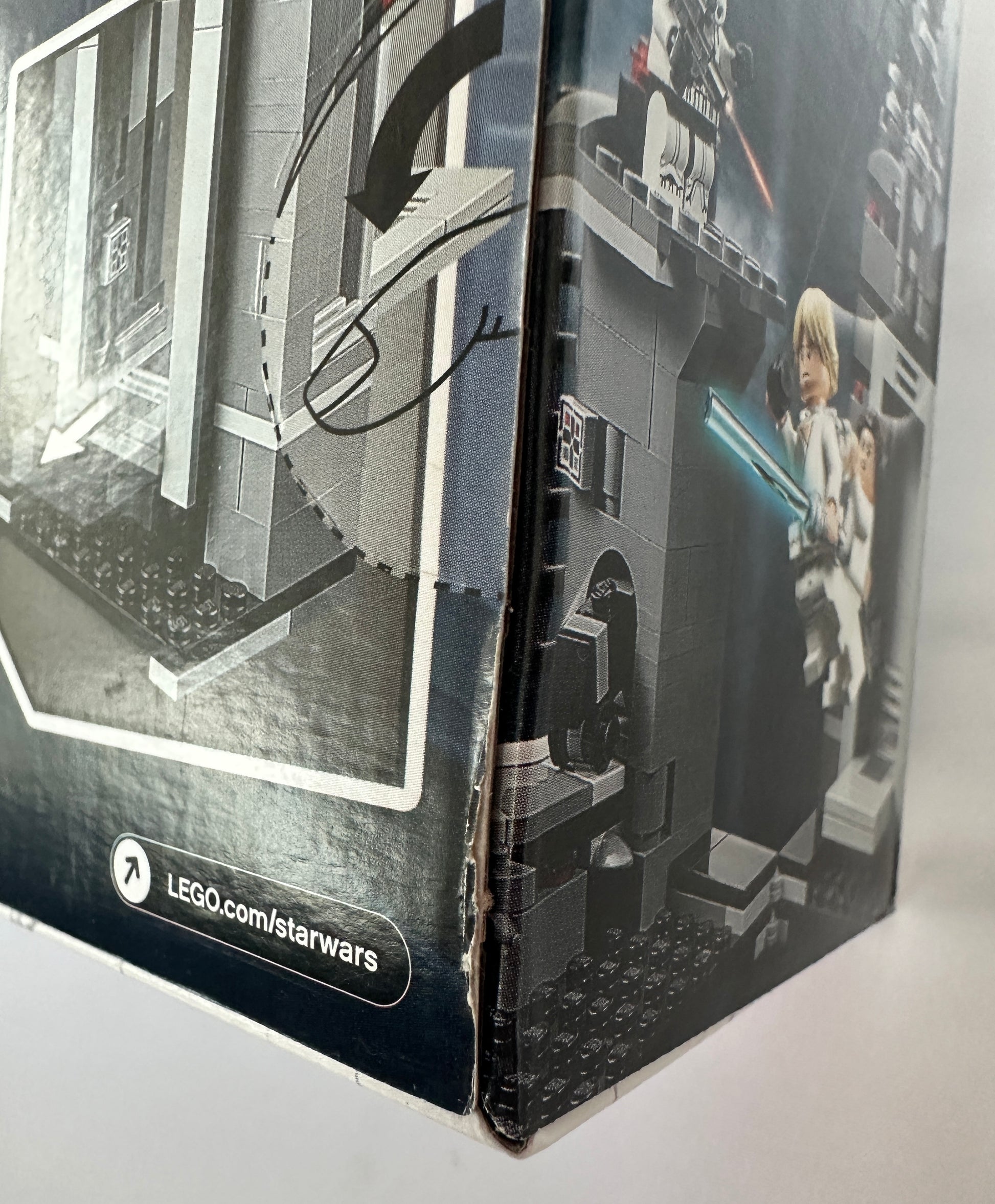 Close-up of a LEGO Star Wars packaging with a model and branding.