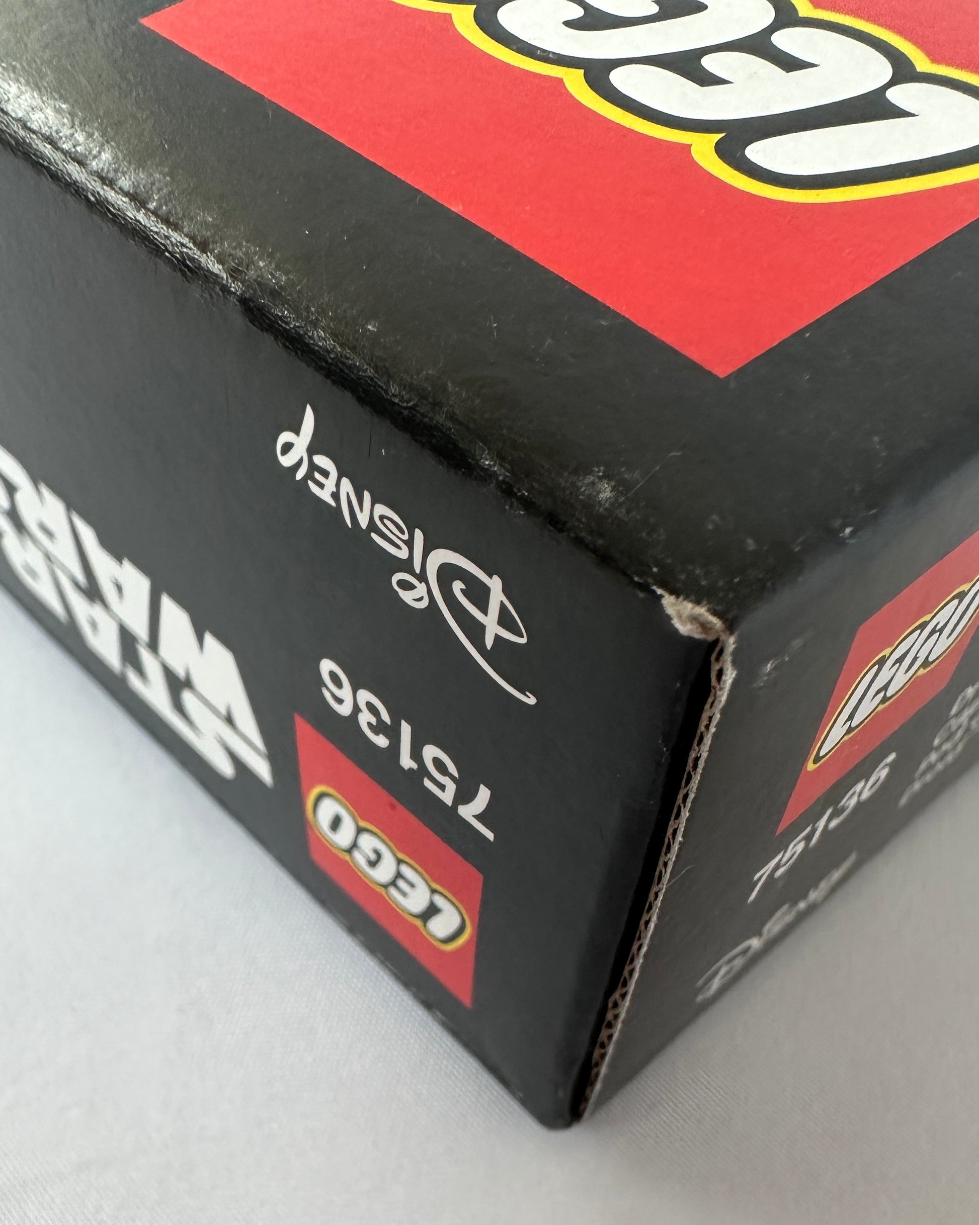 Close-up of a LEGO box with branding and product details.