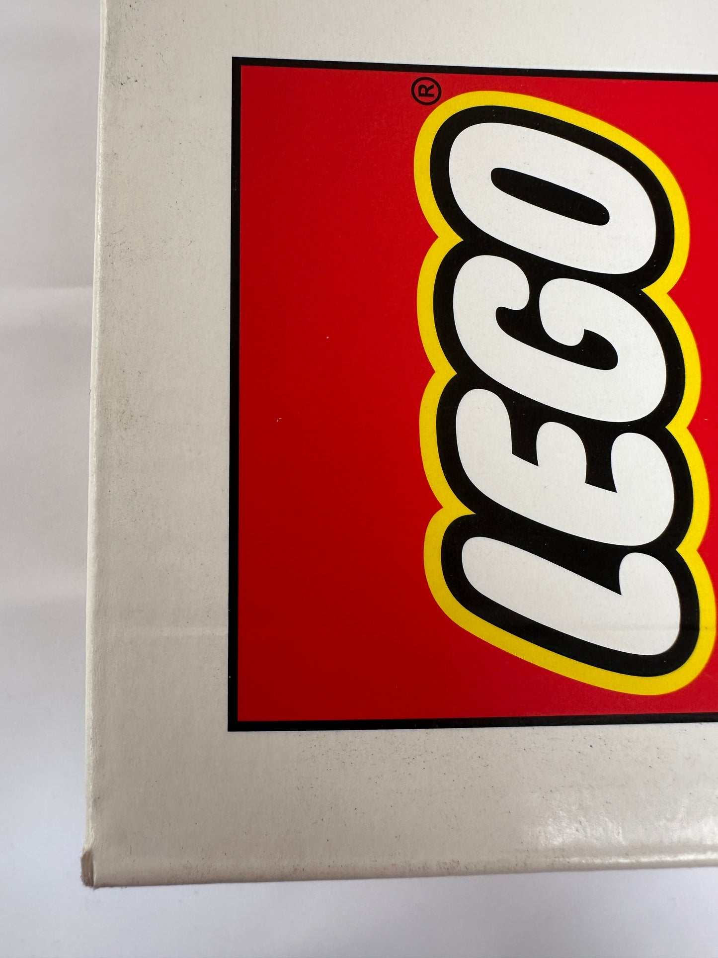 Close-up of a LEGO logo on a red background