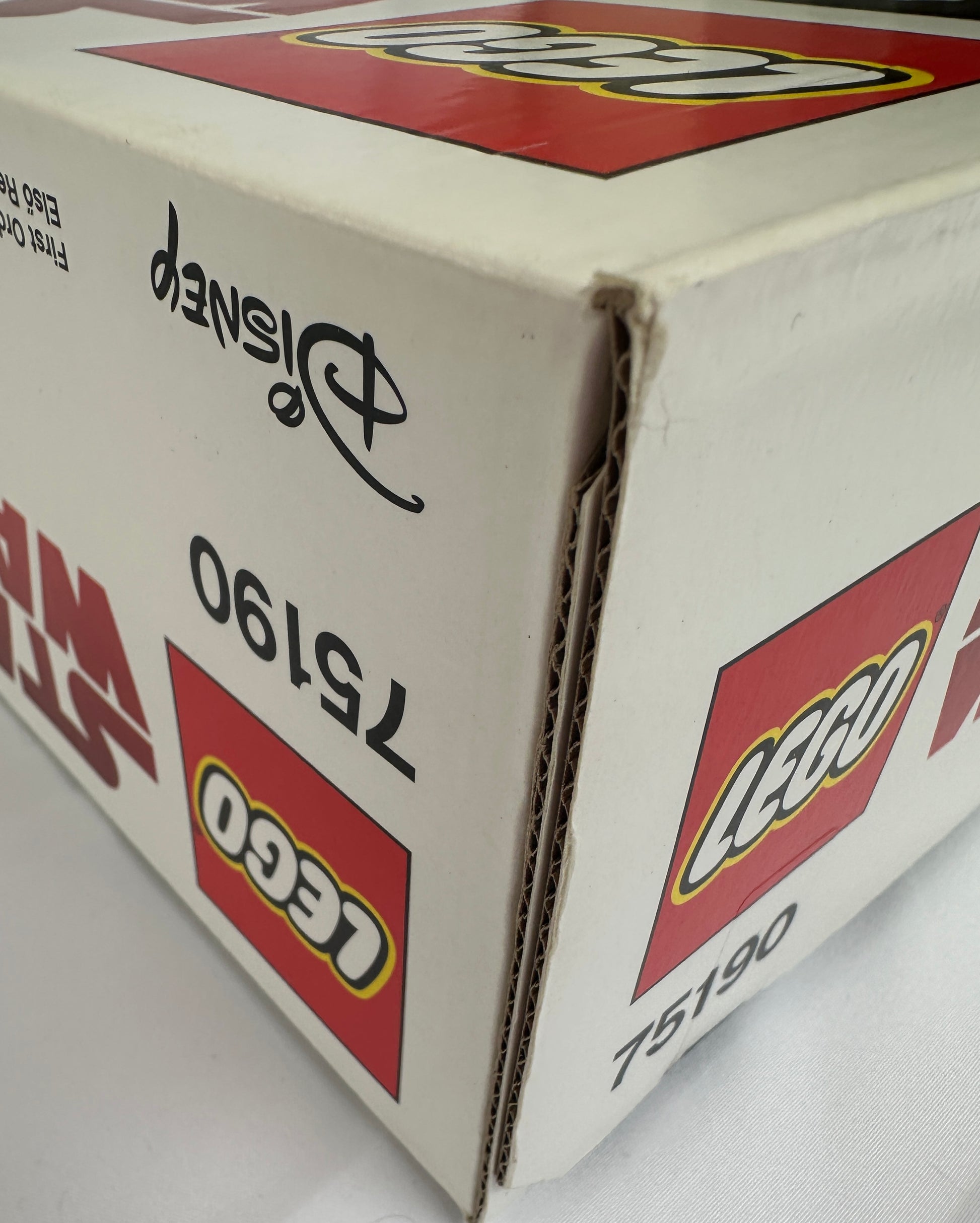 Close-up of a LEGO box with branding and product number.
