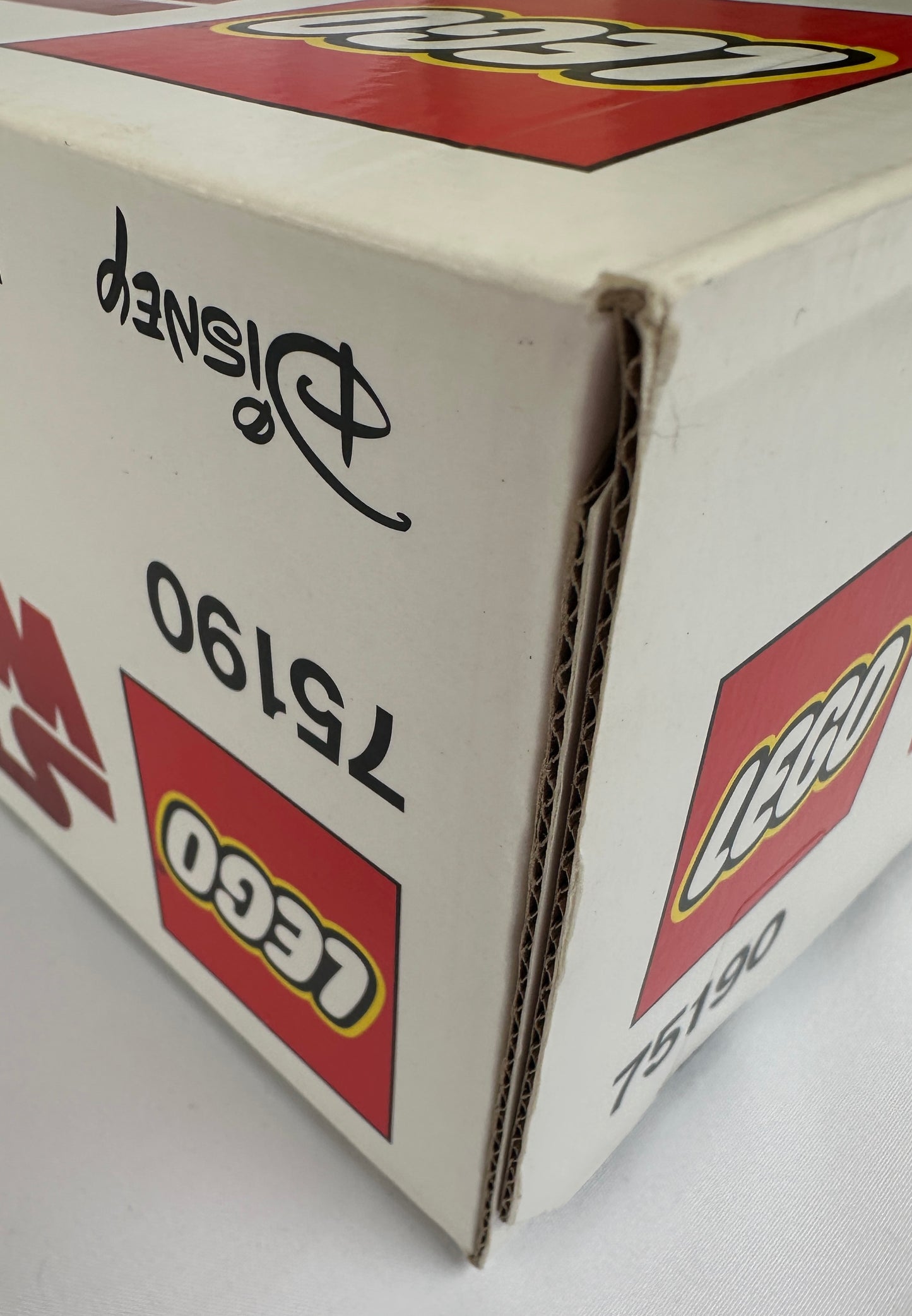 Close-up of a LEGO box with branding and product number.