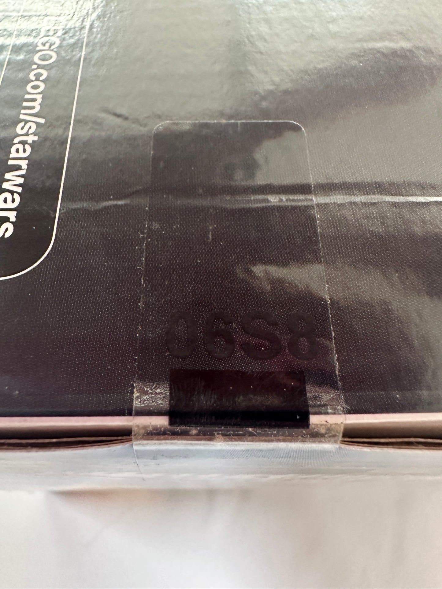 Close-up of a Star Wars product packaging with a visible URL.
