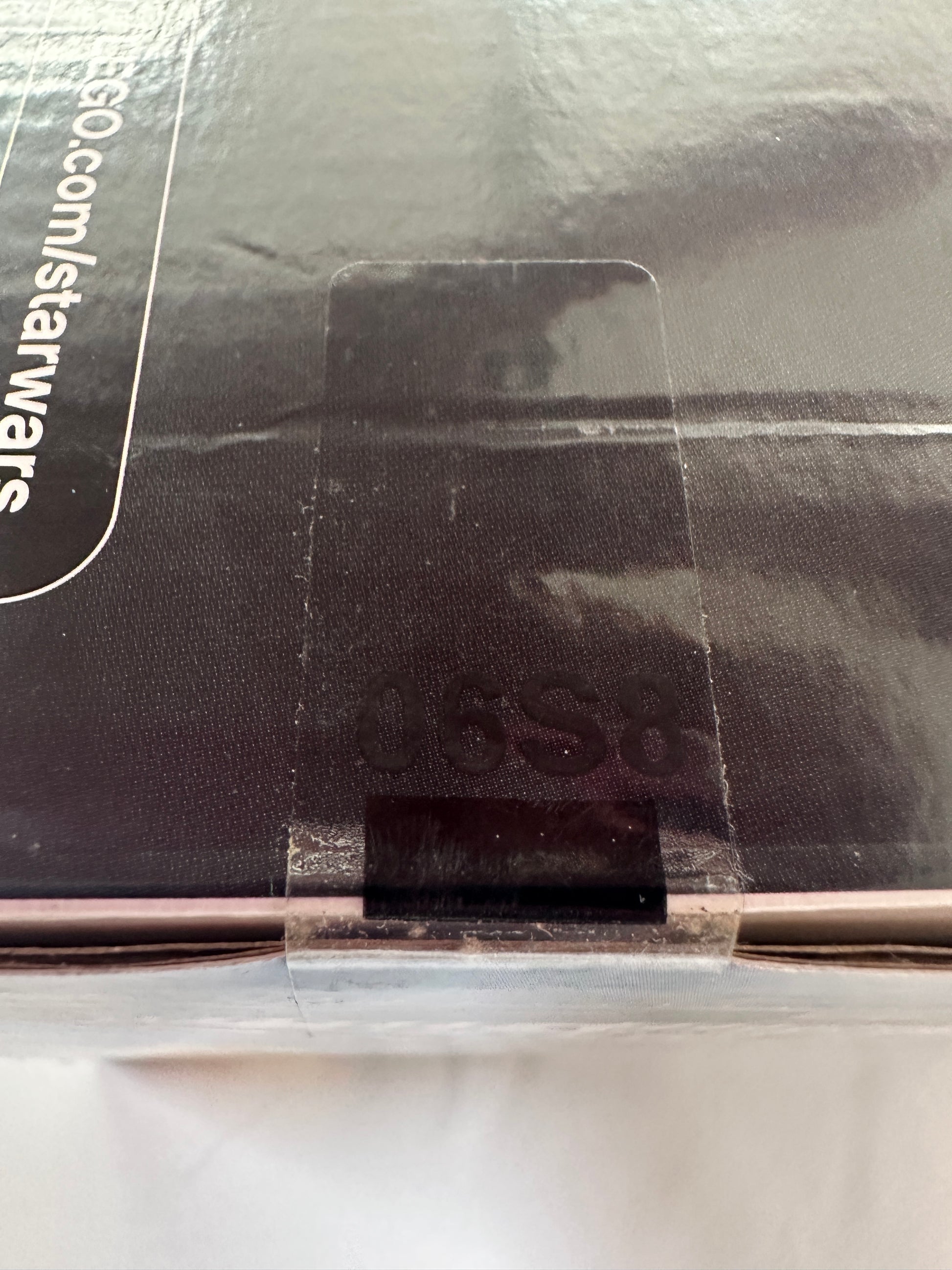 Close-up of a Star Wars product packaging with a visible URL.