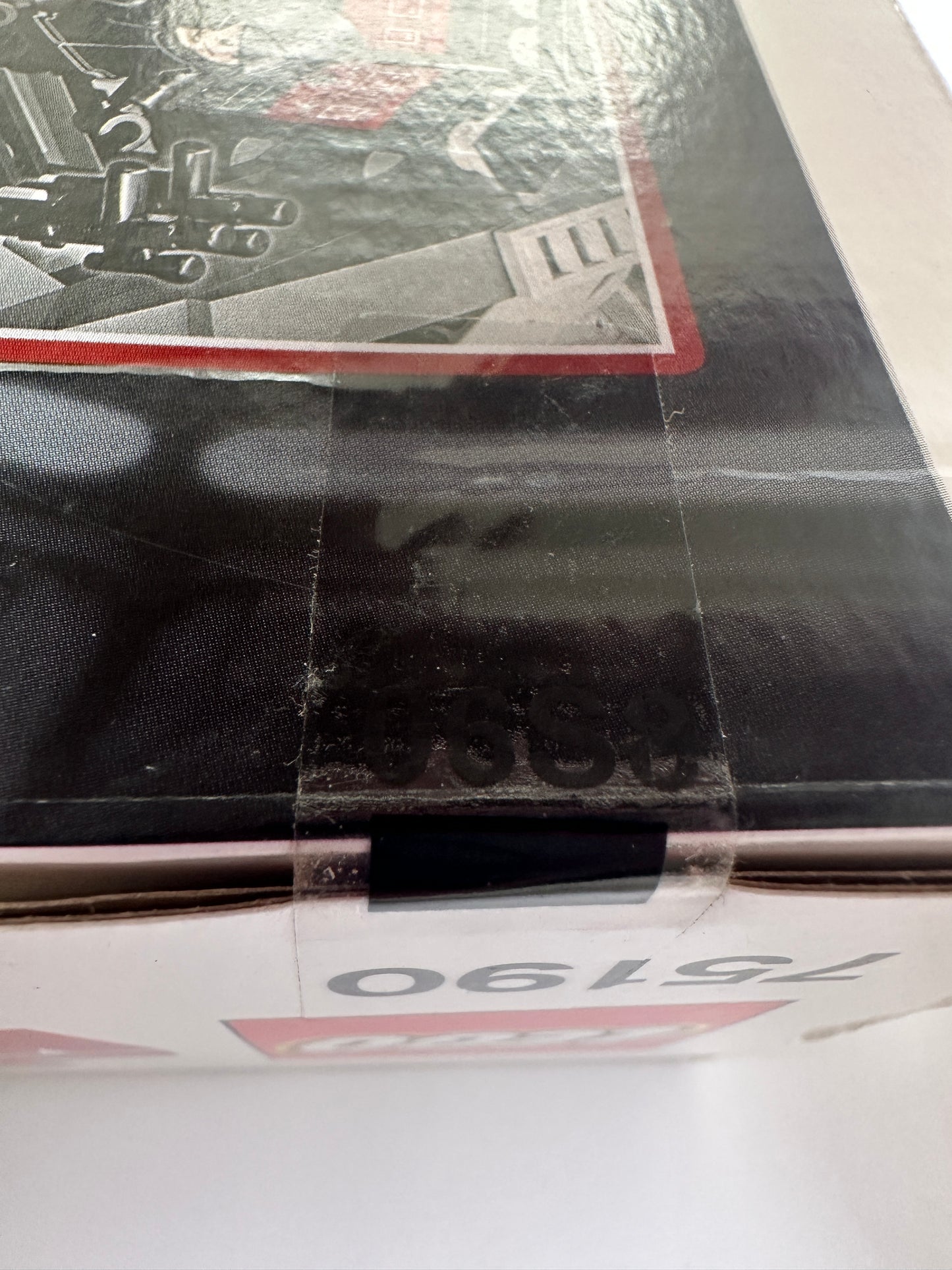 Close-up of a product with a visible brand logo on a black surface