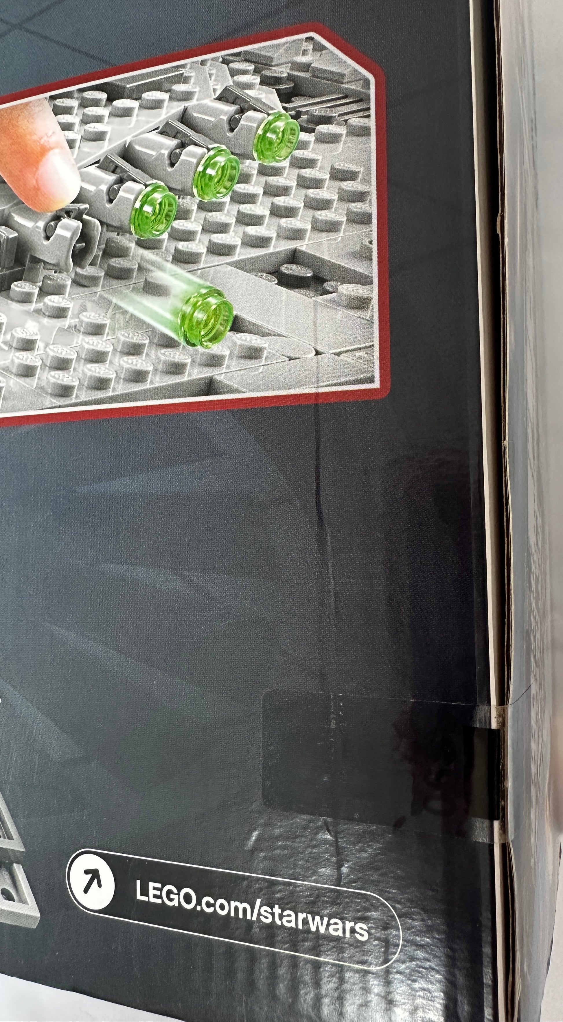 Close-up of LEGO pieces with a focus on a Star Wars theme, featuring a LEGO.com link.