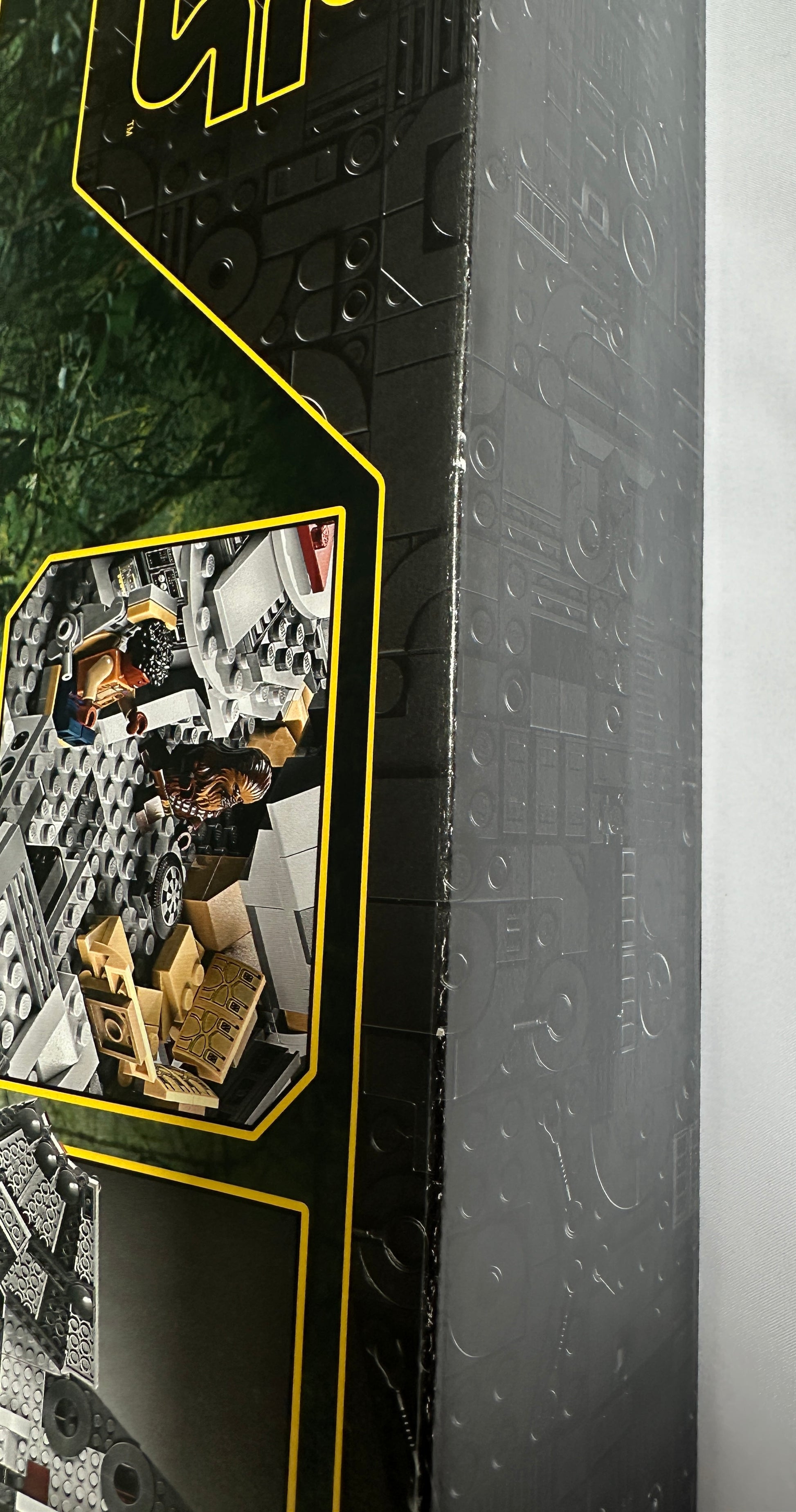 Close-up of a toy set packaging with a character figure inside, featuring a brand logo.
