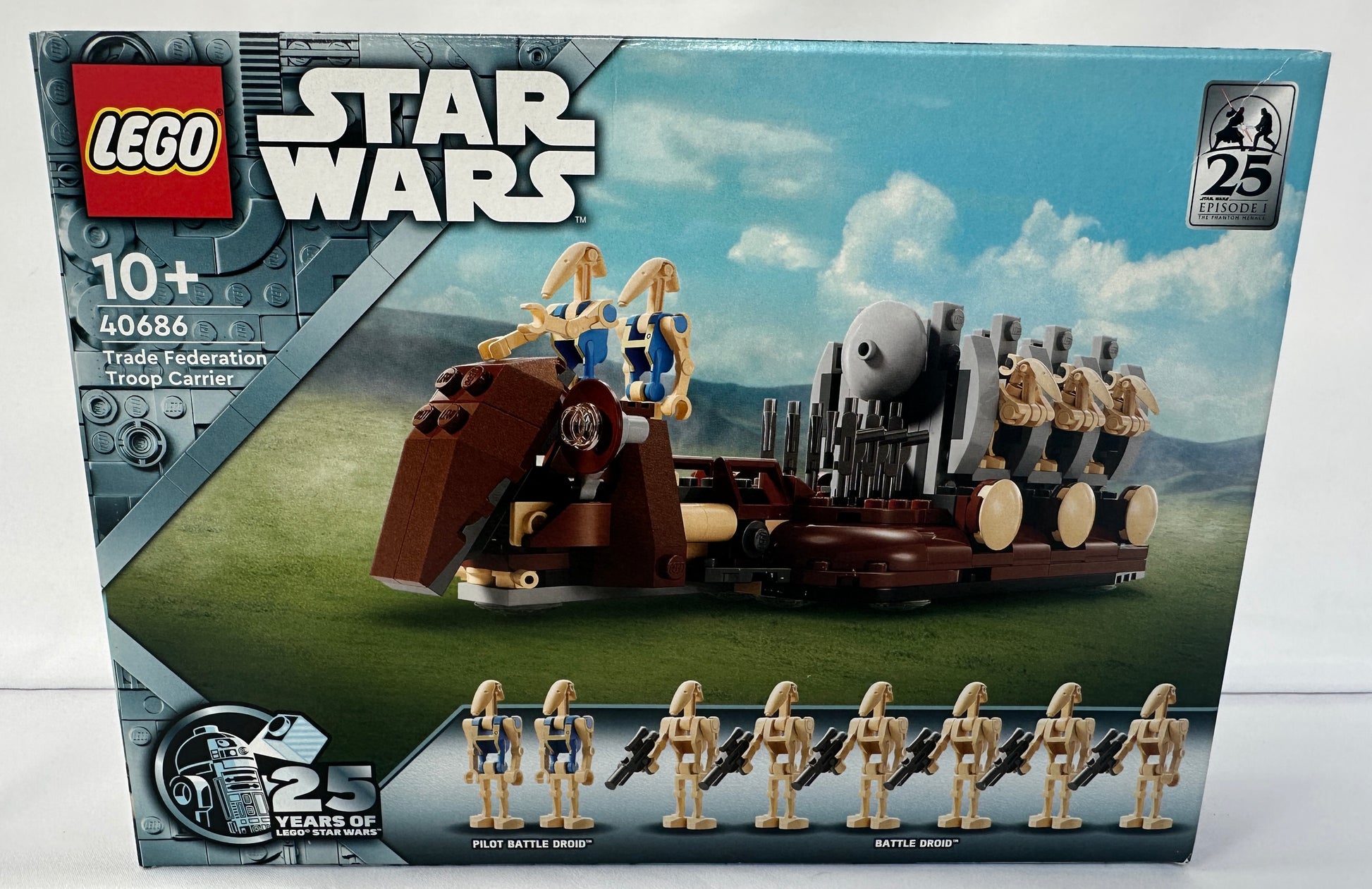 LEGO Star Wars toy set packaging with figures and vehicle on a scenic background