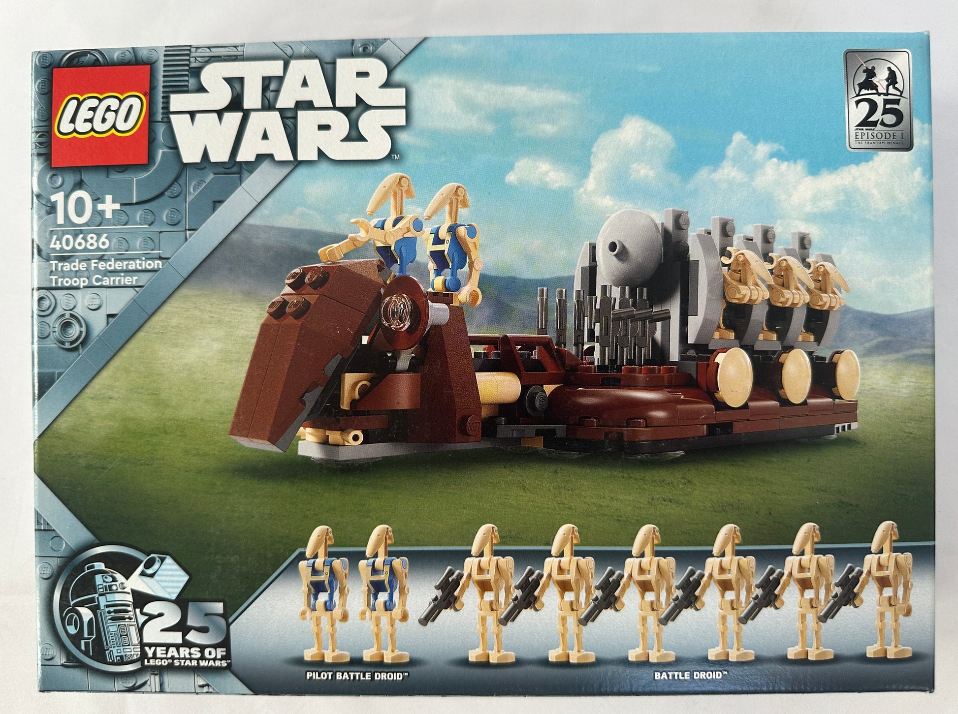 LEGO Star Wars toy set packaging with figures and vehicle model on a scenic background